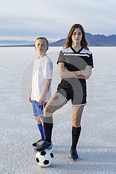 Outdoor portrait of two confident young soccer players