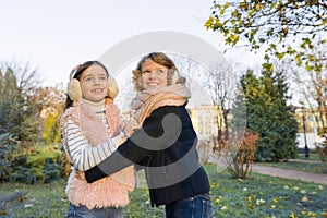 Outdoor portrait of two little girls best friends