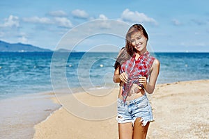 Outdoor portrait of young beautiful happy stylish girl in summer