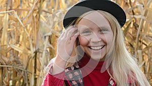 Outdoor portrait of young beautiful teen girl smiling and looking into camera