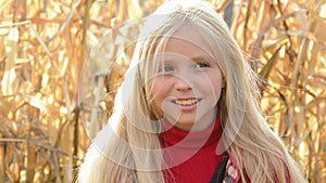 Outdoor portrait of young beautiful teen girl smiling and looking into camera