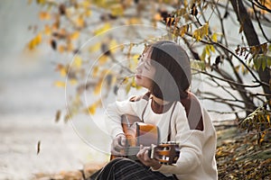 Asian girl playing the guitar.Country Western Musician