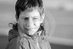 outdoor portrait of young happy smiling teen boy on outdoor natural background