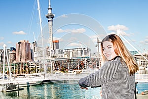 Outdoor portrait of young happy smiling teen girl enjoying her t