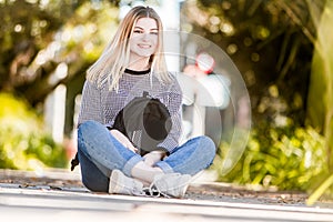 outdoor portrait of young happy smiling teen girl on natural background on a sunny day