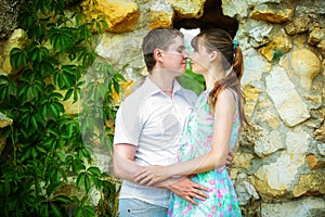 Outdoor portrait of young sensual couple. Love and kiss. Summer