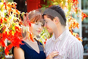 Outdoor portrait of young sensual couple. Love and kiss. Summer