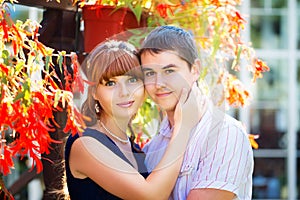 Outdoor portrait of young sensual couple. Love and kiss. Summer