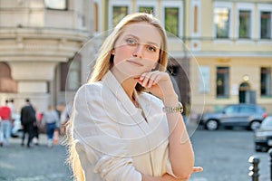 Outdoor portrait of young successful smiling business woman