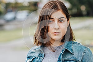 Outdoor portrait of young teenage 16 year old girl