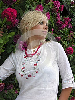 outdoor portrait of young ukrainian woman in traditional ukrainian clothes