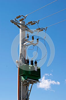 Outdoor power high voltage electric transformer on mast