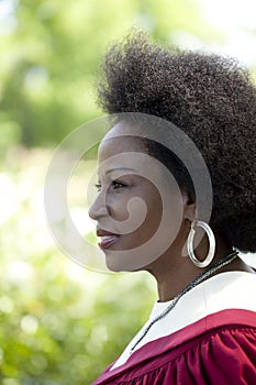 Outdoor profile portrait black woman church robes