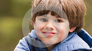 Outdoor prtrait of cute young boy