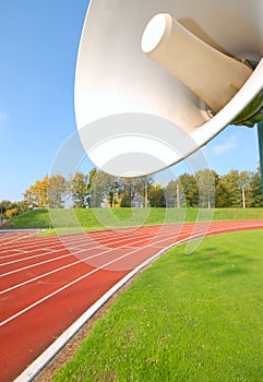 Outdoor racetrack for runners, with speaker