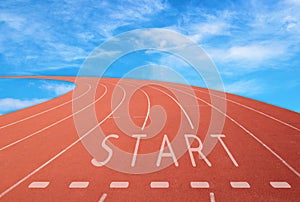 Outdoor racetrack with sign start with blue sky background