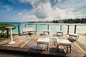 Outdoor restaurant at the beach. Cafe on the beach, ocean and sky. Table setting at tropical beach restaurant. Dominican