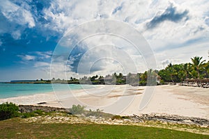 Outdoor restaurant at the beach. Cafe on the beach, ocean and sky. Table setting at tropical beach restaurant. Dominican