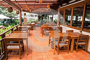 Outdoor restaurant interiour with wooden floor and furniture