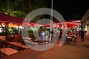 Outdoor restaurant on Lincoln Road Mall in Miami Beach, Florida at night.