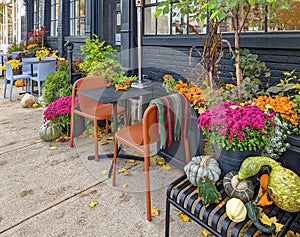 Outdoor restaurant seating with colorful Autumn motif