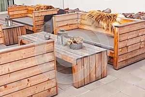 Outdoor restaurant terrace with wooden furniture