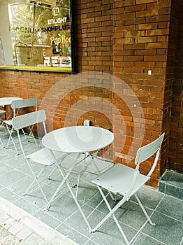 outdoor restaurant white iron bench