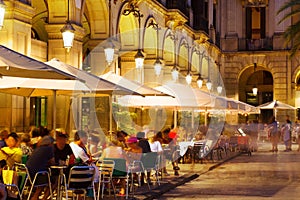 Outdoor restaurants at Placa Reial in night. Barcelona