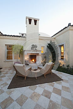 Outdoor Room At Dusk With Fireplace