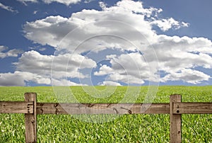 Outdoor Scene With Wood Fence, Sky and Grass