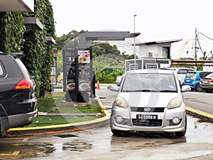 Outdoor scenery McDonald`s restaurant drive through area.