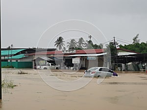 Outdoor scenery during raining season with flash flood at Menggatal Road.