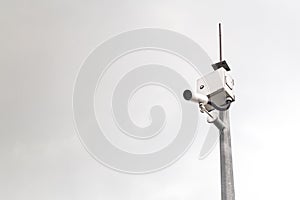 Outdoor security surveillance cctv camera against gloomy sky