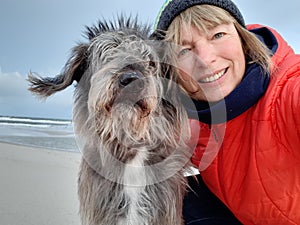 Outdoor Selfie with mixed breed dog at the sea