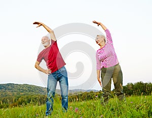 outdoor senior fitness woman man lifestyle active sport exercise healthy fit retirement stretching elderly couple