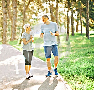 outdoor senior fitness woman man lifestyle active sport exercise healthy fit runner couple running jogging elderly