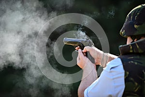 Outdoor shooting with a 9mm pistol in a shooting range