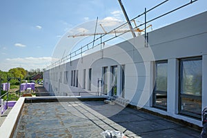 outdoor shot of a building that is in the process of completion on a construction site