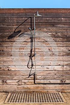 Outdoor Shower Made Of Brown Wooden Boards