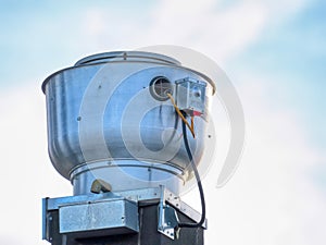 An outdoor side part of a commercial exhaust hood fan