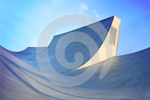 generic skatepark ramps low view to show scale with blue saturation photo