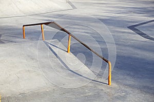 Outdoor skatepark with ramp on a sunny day.