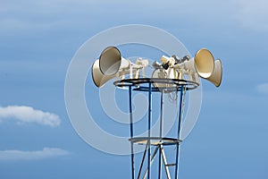 Outdoor speakers in blue sky background