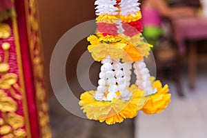 Outdoor spirit house in Thailand. garland and some wreathes