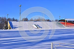 Outdoor sports stadium in the snow a clear winter day without people.