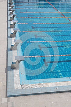 outdoor sports swimming pool with lanes and bollards for jumping