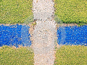 Outdoor stadium. Colorful lines in empty outdoor handball playground, plastic light green surface on ground and white, red and