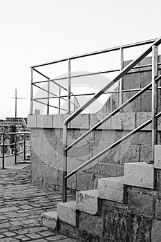 Outdoor stairs with metal handrails. Black and white photography
