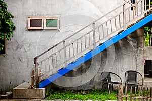 Outdoor stairway and blue clour withl wall texture on vintage st