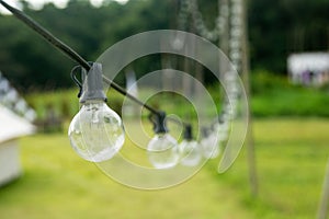 Outdoor string Light bulbs hanging on a line